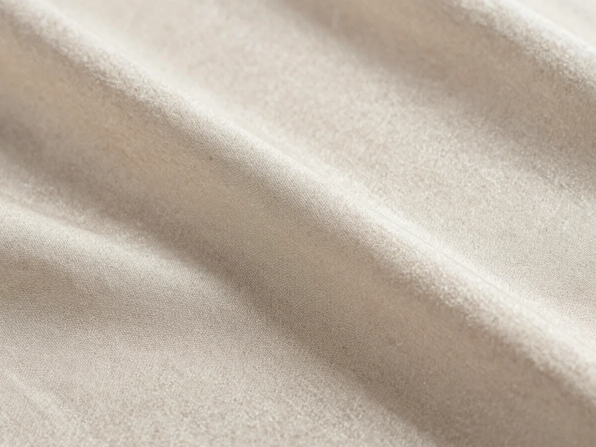 Editorial textile photography, extreme macro of a pure silk fabric surface, soft directional daylight revealing fine war