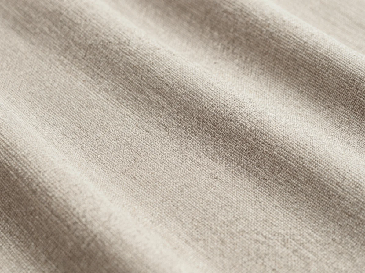 Editorial textile photography, close-focus detail of a silk-mixture weave with visible fiber blend texture, soft directi
